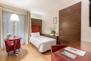 Postel nebo postele na pokoji v ubytování Art Hotel Navigli