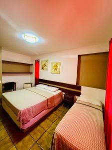 Postel nebo postele na pokoji v ubytování Pousada Bossa Nova