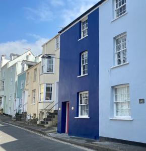 a blue building on the side of a street at Little Monmouth 4 bedroom cottage, Old town Lyme Regis, dog friendly and parking in Lyme Regis