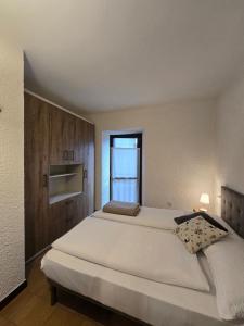 Postel nebo postele na pokoji v ubytování bb26 apartment mountain Lozio