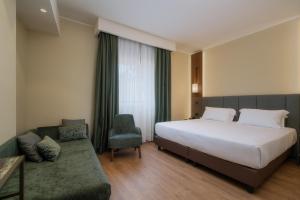 A bed or beds in a room at Hotel Mozart