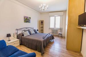 Ένα ή περισσότερα κρεβάτια σε δωμάτιο στο Casa Gabriella