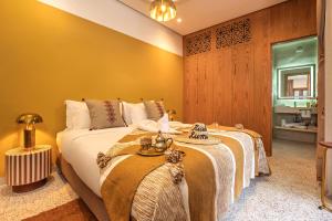 Postel nebo postele na pokoji v ubytování Riad Rumi Marrakech Medina