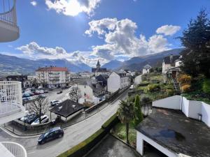 a view of a city with a street and buildings at Le balcon du Hautacam in Argelès-Gazost