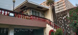 a building with a balcony with christmas decorations on it at The Terrace Room in Manila
