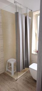 a bathroom with a shower with a tub and a toilet at La Casa di Giò in Taormina
