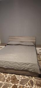 a large bed in a room with at La Casa di Giò in Taormina