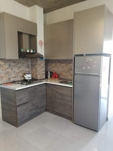 Kuchyň nebo kuchyňský kout v ubytování Verona Apartment