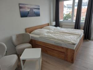 Postel nebo postele na pokoji v ubytování Wohnung Sonnenschein inkl Strandkorb vom 01 05-01 10
