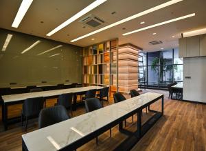 a meeting room with tables and chairs in a building at Well-Shaped Suites At STAR KLCC in Kuala Lumpur +92 photos
