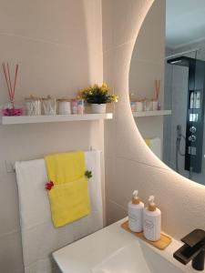 a bathroom with a sink and a mirror at Casa Teo. in Santa Pola +46 photos