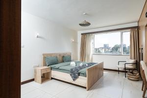 Postel nebo postele na pokoji v ubytování Silvermist Two & Three Bedrooms Wonderiss Homes Westland Living with close proximity to UN, Karura forest & Sarit Mall