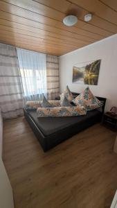 a bedroom with a large bed with pillows on it at Via Roma 257 Apartament in Cochem