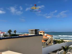a view of the beach from the balcony of a house at Villa Bonita in Corralejo