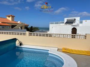 a swimming pool on the roof of a house at Villa Bonita in Corralejo