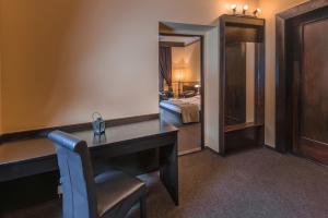 Postelja oz. postelje v sobi nastanitve Hotel Lovecký zámeček Orion