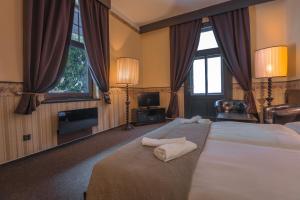 Postelja oz. postelje v sobi nastanitve Hotel Lovecký zámeček Orion