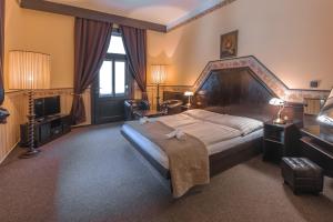 Postelja oz. postelje v sobi nastanitve Hotel Lovecký zámeček Orion