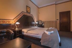 Postelja oz. postelje v sobi nastanitve Hotel Lovecký zámeček Orion