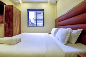 Postel nebo postele na pokoji v ubytování Hotel deluxe
