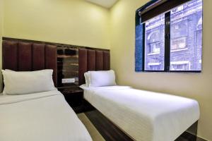 Postel nebo postele na pokoji v ubytování Hotel deluxe