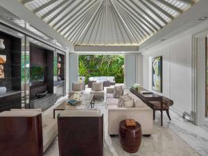 a living room with a couch and chairs and a table at Sofitel Bali Nusa Dua Beach Resort in Nusa Dua