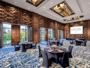 a conference room with tables and chairs and windows at Sofitel Bali Nusa Dua Beach Resort in Nusa Dua +37 photos