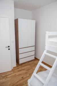 Ένα ή περισσότερα κρεβάτια σε δωμάτιο στο Apartman Tasic