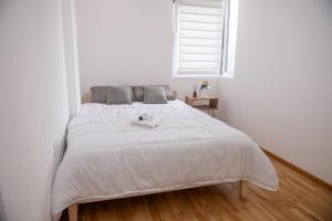 Ένα ή περισσότερα κρεβάτια σε δωμάτιο στο Apartman Tasic