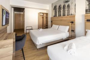 Katil atau katil-katil dalam bilik di B&B HOTEL Como Baradello