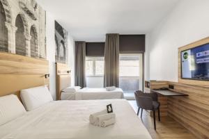 Katil atau katil-katil dalam bilik di B&B HOTEL Como Baradello