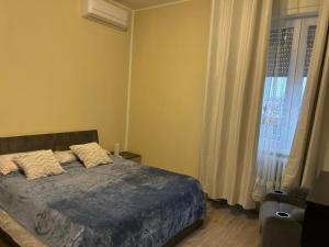Postel nebo postele na pokoji v ubytování Stanza Dima