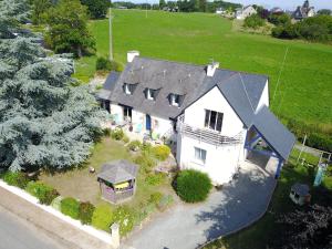 an aerial view of a white house with a gray roof at Chalet in Plouër-sur-Rance