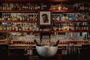 a bar filled with lots of bottles and glasses at Experimental Marais in Paris