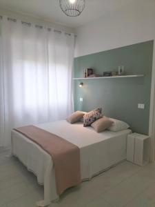 Postel nebo postele na pokoji v ubytování Lugore Room