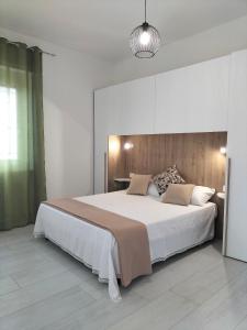 Postel nebo postele na pokoji v ubytování Lugore Room