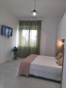 Postel nebo postele na pokoji v ubytování Lugore Room