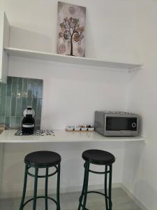 Kuchyň nebo kuchyňský kout v ubytování Lugore Room
