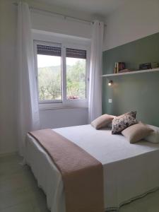 Postel nebo postele na pokoji v ubytování Lugore Room