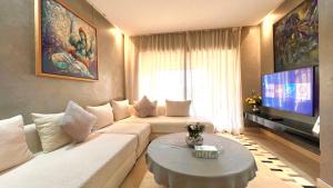 Et tv og/eller underholdning på Prestigia Appartement de luxe