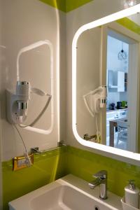 a bathroom with a sink and a mirror at Albachiara in Bari