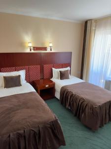 Ένα ή περισσότερα κρεβάτια σε δωμάτιο στο Hotel Bukhara Grand Adress Ibrohim Muminov Str 8