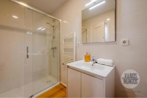 a bathroom with a shower and a sink and a mirror at Tu balcón en Madrid para 3, Carretas 25 in Madrid