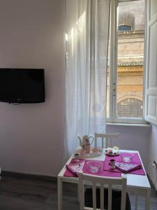 Et tv og/eller underholdning på ROMA - Loft Campo de' Fiori - Appartamento Campo de' Fiori - LE CUGINE