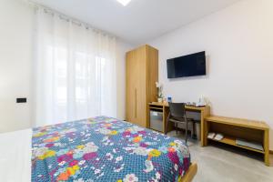 Posteľ alebo postele v izbe v ubytovaní I 4 Calici