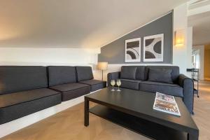 a living room with a couch and a coffee table at Appartamento al Vaticano in Rome