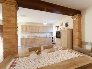 a kitchen with a table with a bowl of fruit on it at Casa Paradiso - Assisi in Assisi