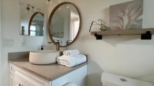 a bathroom with a sink and a mirror at Venice-Manasota Key Getaway in Venice +19 photos