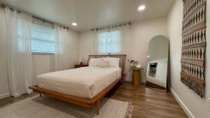 a bedroom with a bed and a large window at Venice-Manasota Key Getaway in Venice