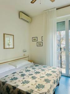 Postel nebo postele na pokoji v ubytování Hotel Erika